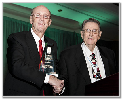 (Photo: TAB 1987 Chairman John Barger presents the award to Tom Perryman at TAB's 2013 Convention & Trade Show)